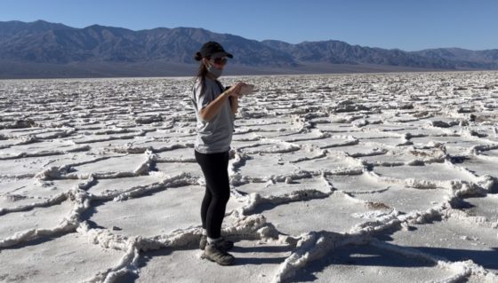 Lexi takes pictures of the salt flats in Badwater Basin in Death Valley